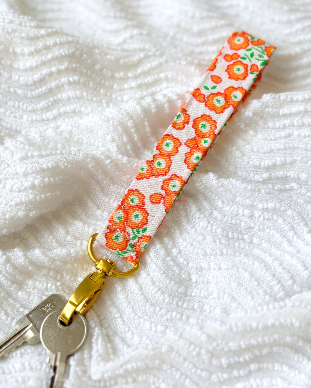 Porte-clés petites fleurs orange