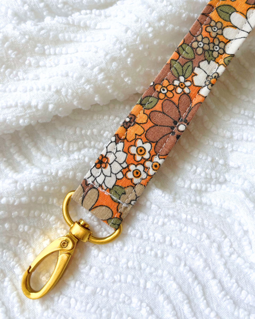 Porte-clés flower power orange